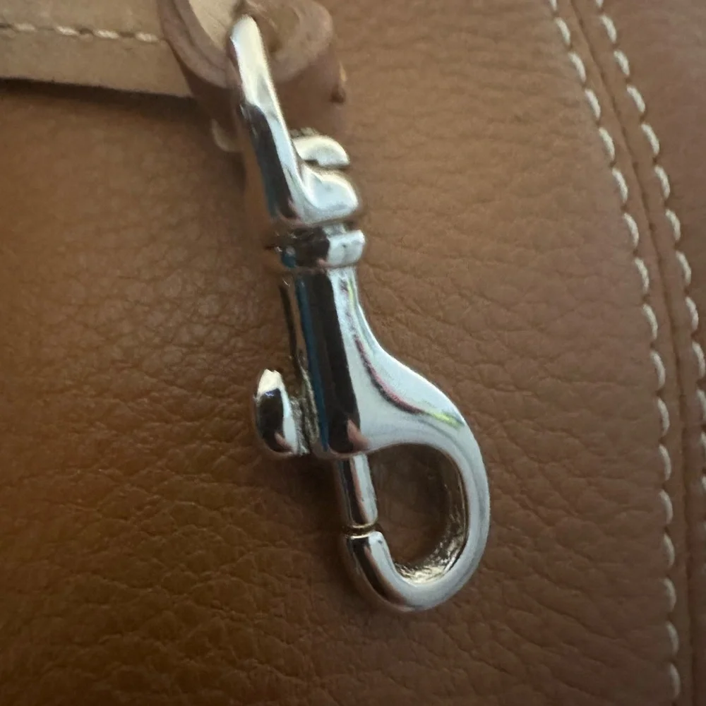 Dooney & Bourke Pebbled Grain Pocket Sac Crossbody with Side Pockets.